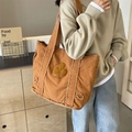 Retro caramel brown canvas tote bag with clover patch and frayed edges design - Raw Edge Clover Patch Style / Brown