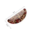 Detail view of mini acetate hair comb with tortoiseshell pattern and 9cm width dimension - Amber Tortoiseshell