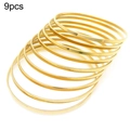 Set of 9 minimalist gold-plated stacking bangles with a polished titanium steel finish - Inner Diameter 55mm / 3mm Gold (9 Rings)