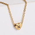 Polished 18k gold heart necklace featuring a bold black engraved letter N pendant - Letter N