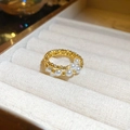 Macro shot of minimalist gold beaded ring with five elegant white pearls in a jewelry box - Double Layer Beaded Ring / Gold