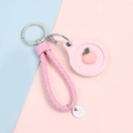 Pink braided leather key ring case with cute peach charm for access cards or AirTags - Hand Strap Style - Peach