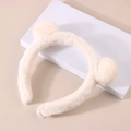 Detail of plush cream headband with fluffy pom-pom ears for skincare and makeup - Hair Hoop-Simple Cream White