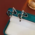S925 silver wave earrings with black enamel inlay on green velvet box display - Black (S925 Silver Needle)