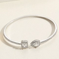 Macro shot of silver open cuff bracelet with pear and square cut cubic zirconia gems - SL0184-5 Waterdrop Square Zircon Bangle White Gold Plated / Silver