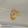 Dettaglio dell'anello a doppio strato in acciaio inossidabile con cuore, 2,6g e 17mm diametro - Doppio Strato/Aperto / Oro/Cuore Rosa
