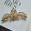 Elegant spider hair claw clip in metallic gold finish for a stylish halloween look - Gold