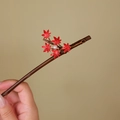 Close-up of carbonized bamboo hair stick with red maple leaves and white pearl detail - Red Maple Leaf (S385)