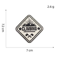 Macro shot of mountain embroidery patch with CLIMBING text and cross tools detail - Patch 9