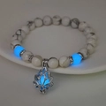Luminous lotus charm bracelet with white turquoise beads and glowing blue accents - 8mm Natural White Turquoise with Blue Light