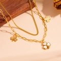 Close-up of double layer gold clover pendant necklace on textured background - Necklace (L601项链)