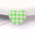 Detail of heart-shaped zinc alloy charm with green checkered enamel and pearls - Green