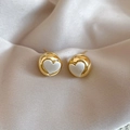 Detailed close-up of golden heart-shaped stud earrings on champagne silk fabric - Silver Needle Gold Silver Heart Style (WE5514)
