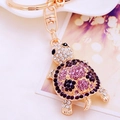 Golden turtle keychain with purple and pink rhinestones on a metal keyring loop - Purple Rhinestone Turtle