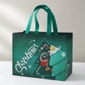 Green non-woven Christmas gift bag with white Merry Christmas text and festive patterns - Christmas Style 40