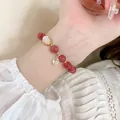 Elegant strawberry quartz bracelet with golden Fu pendant and white cloud charm - Strawberry Crystal Gourd Style (14#)
