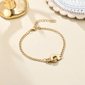 Detail of 18K gold plated stainless steel bracelet with handcuffs pendant and lobster clasp - Handcuffs Pendant Style
