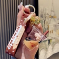 Bubble tea sleutelhanger met beertje, vloeibare zandfles en bruine siliconen polsband - Melkthee Beker Beer