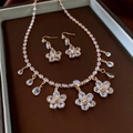 Detail view of vintage gold floral necklace and earrings set in a jewelry box - 20# Necklace Earrings Set-Gold White Style
