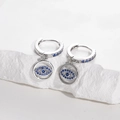 Silver Evil Eye huggie earrings with sparkling blue zircons and stainless steel finish - Silver-Blue Zirconia