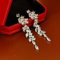 Detail of long silver tassel earrings with marquise cubic zirconia in a red jewelry box - Silver