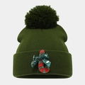 Detail of green Christmas beanie with large pompom, candy cane patch and festive bow - One Size / Military Green Candy Cane
