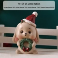 Christmas bunny resin figurine wearing a Santa hat and holding a festive green wreath - Resin / Rabbit - Kraft Box (7116R-05)