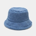 Close-up detail of thick blue teddy fleece fabric texture on a winter bucket hat - One Size / Blue
