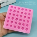 Close-up of pink silicone mold with 30 micro cherry blossom cavities for DIY nail art crafts - Silicone / 36-Cavity Small Flower - Pink