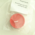 Red smokeless tealight candle in transparent plastic shell with white heart-shaped card - Red (Intoxicating Print)