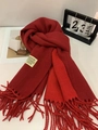 Red color-block cashmere-feel scarf with fringe and minimalist label on white surface - Burgundy