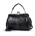 Retro black leather handbag with metal frame and double bead clasp in studio lighting - Black