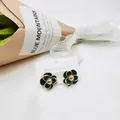 Elegant black and gold camellia flower earrings made of stainless steel for women - Black