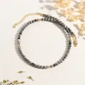 Detail of grey marble beads necklace with gold accents and adjustable lobster clasp - Map