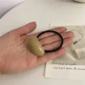 Minimalist elastic hair tie with khaki resin bean charm and black cord for women - Apricot