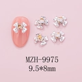 Macro shot of silver bow nail charms with amber heart gems, size 9.5x8mm for DIY manicure - Silver Bow + Yellow Heart Stone (9975)
