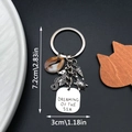 Macro view of sea horse keychain with shell and Dreaming of the Sea engraved charm - Ancient Silver Seahorse Shell Turtle Keychain-ER656