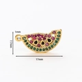 Detailed macro view of a 17mm gold watermelon charm with colorful inlaid zircons - Watermelon Pendant