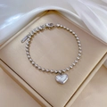 Detailed shot of titanium steel heart pendant bracelet with white mother of pearl inlay - Titanium Steel/Mother of Pearl / Silver (N516 Silver)