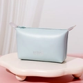 Light blue PU leather makeup bag with LOVE print and zipper closure on a cloud stand - Dumpling Bag / Light Blue