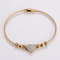 Bracciale rigido dorato con cuore di strass e pratica chiusura magnetica - Oro