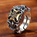 Detailed macro shot of vintage silver ring with gold Maltese cross and S925 engraving - Two-tone Gold Cross