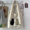 Detail of canvas tote bag featuring cute cat illustrations and artistic minimalist decor - Cat Beige