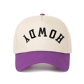 Close-up of HOWDY 3D embroidery on a cream and purple two-tone five-panel trucker hat - Beige/Purple