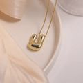 18K gold plated puffer U-shaped pendant necklace on a ceramic tray with silk - Letter U (Single Pendant)