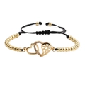 Detail of adjustable gold bead bracelet featuring interlocking double heart charms with crystals - Double Heart Copper Beads Black Rope / Gold + Black Rope