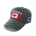 Close-up of vintage charcoal baseball cap with Canada flag patch and embroidery detail - Black