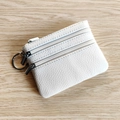 White pebbled leather coin purse with three zippers and a functional silver keychain - White