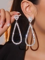 Elegant silver long teardrop earrings with sparkling rhinestones worn by a model - Silver Exaggerated Large Waterdrop Style (DTE1916139S)