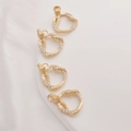 Detailed close-up of 14K gold-plated snake pendants with sparkling cubic zirconia inlay - Triangle Snake / 20mm*16mm